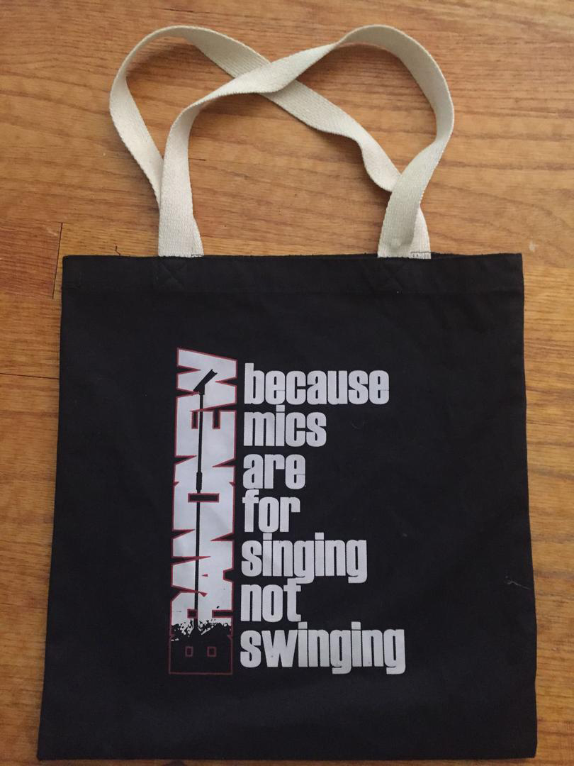 Brand New Black "because mics are for singing not swinging" tote bag