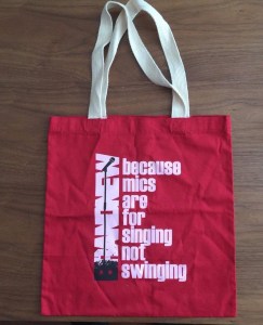 Brand New Red "because mics are for singing not swinging" tote bag